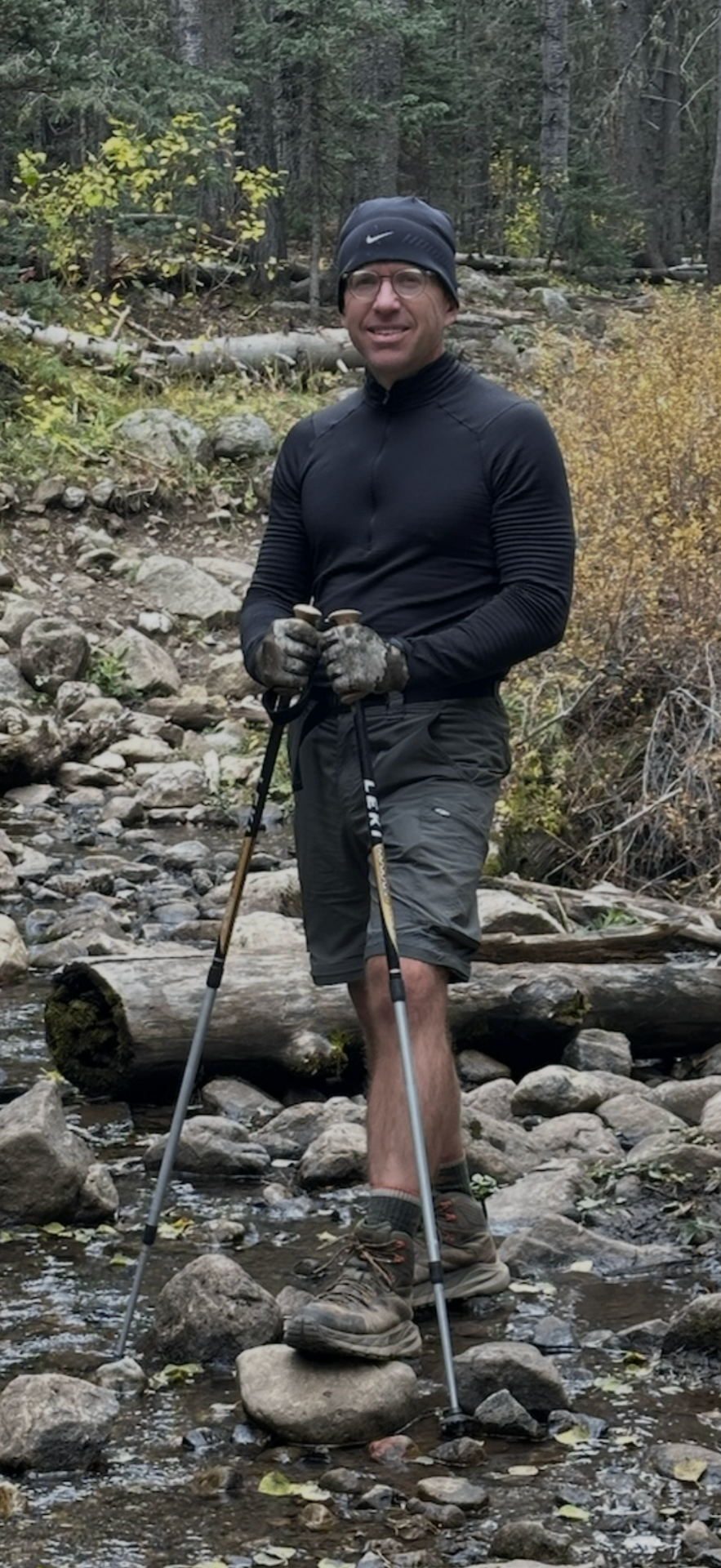 John trekking a Colorado stream
