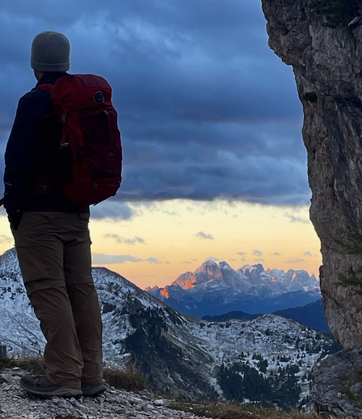John watching sunset over alpine peaks